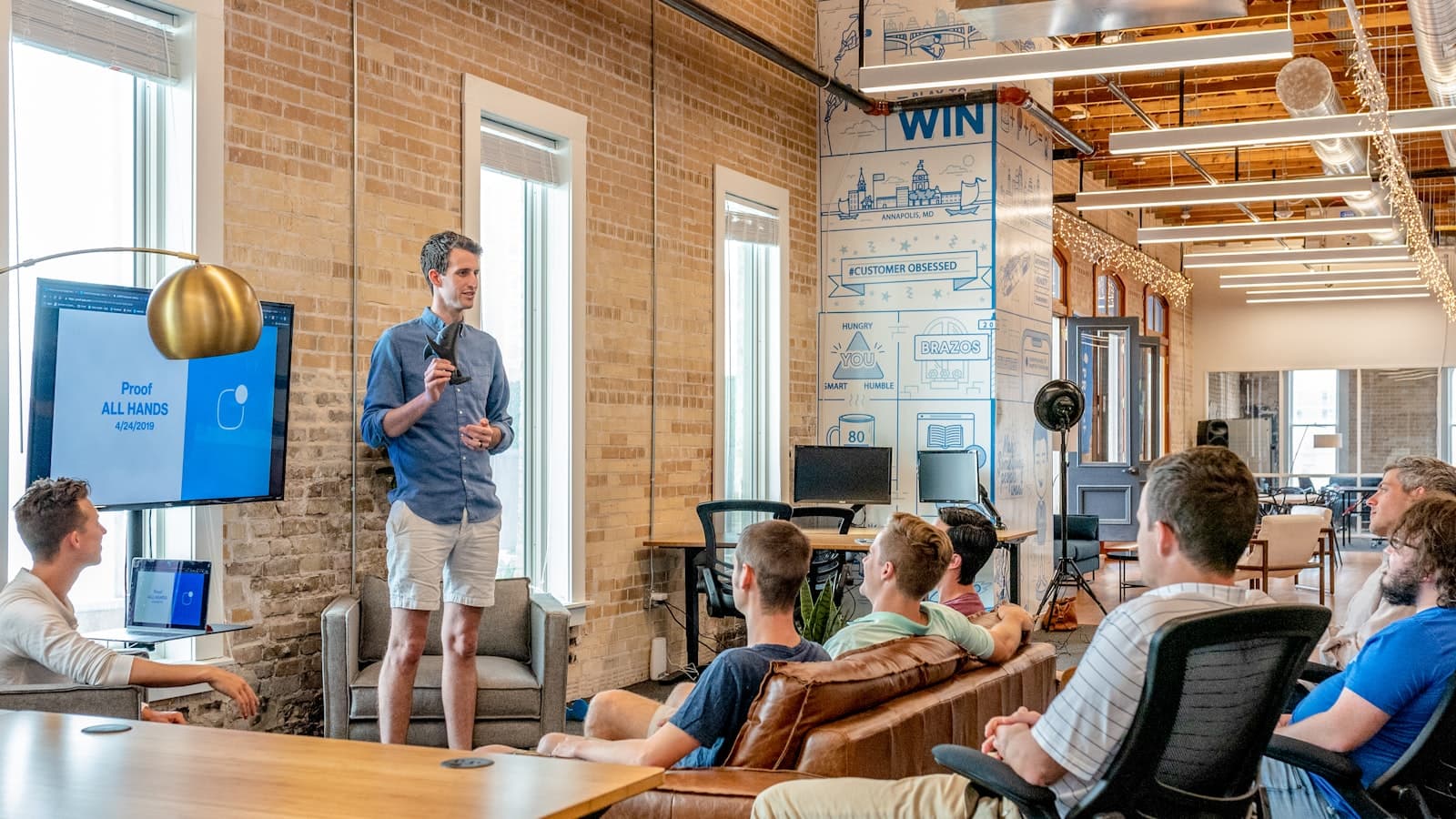 Team standing together in a workspace
