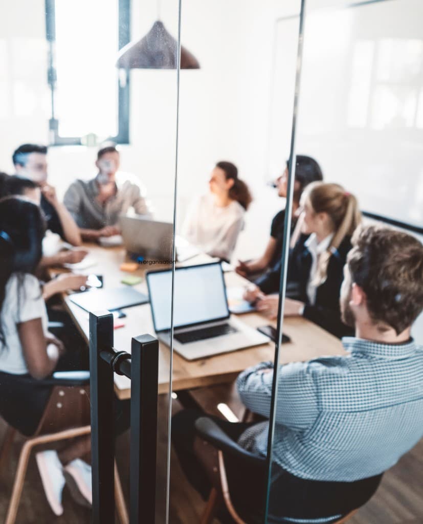 Team collaborating around a table in a bright office