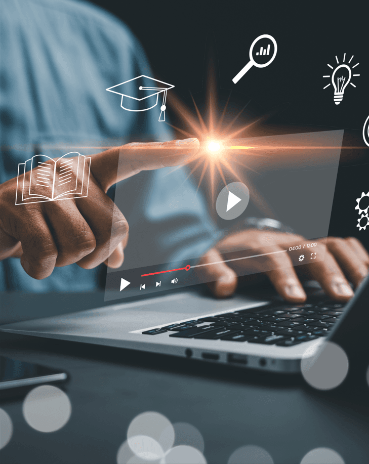 Person using a laptop with digital learning icons